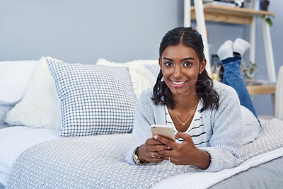 Buy stock photo Indian woman portrait and cellphone or bed relax in home with social media browsing, network or notification. Female person, face and smartphone for online blog from apartment, connection or internet