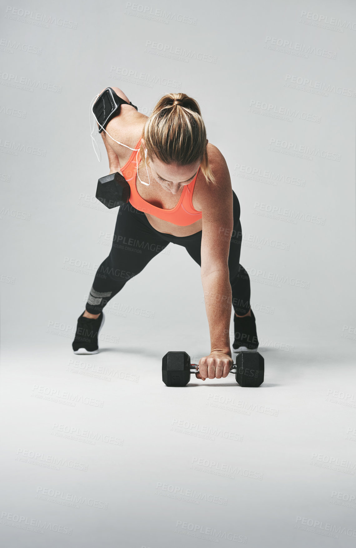Buy stock photo Push up, sports and woman with weights in studio for health, wellness and body training. Fitness, energy and female athlete with equipment for arm workout or exercise isolated by gray background.