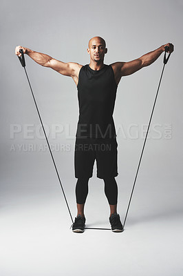 Buy stock photo Man, fitness and resistance band in studio with stretch for healthy athlete with wellness for training. Gym, body care and confidence with commitment on white background with exercise for workout