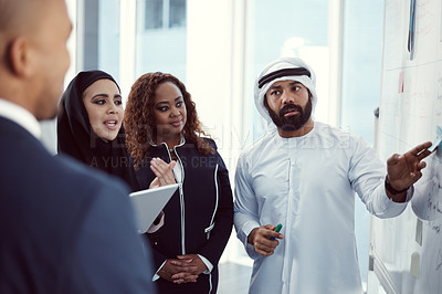 Buy stock photo Meeting, presentation and team of business people in office for planning, trading workshop and conference. Investment discussion, middle east advisor and speaker with employee at expo in Dubai 
