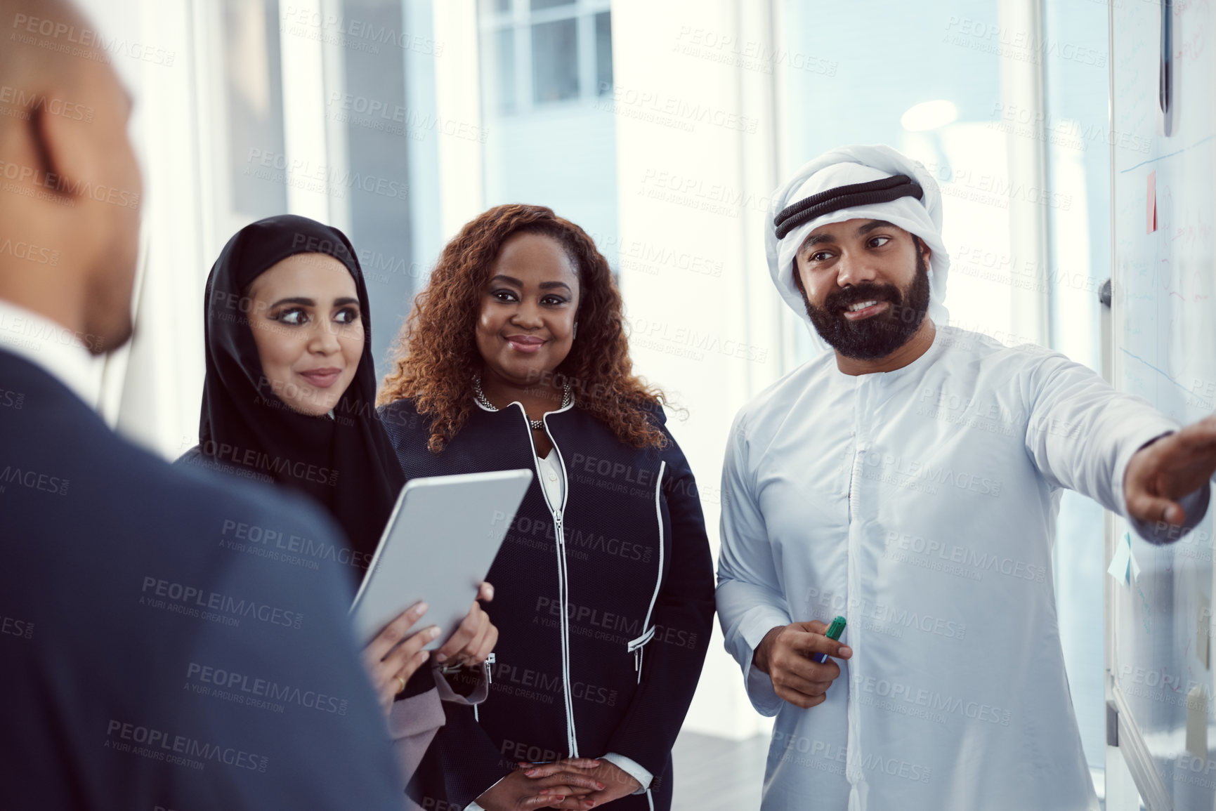 Buy stock photo Meeting, speaker and planning of business people in office for team, trading workshop and conference. Investment discussion, middle east advisor and presentation with employee at expo in Dubai 