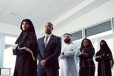Buy stock photo Business, people and serious in row in office for legal justice, muslim coworkers and about us. Low angle, lawyer team and arab colleagues at firm for company diversity, arms crossed and leadership