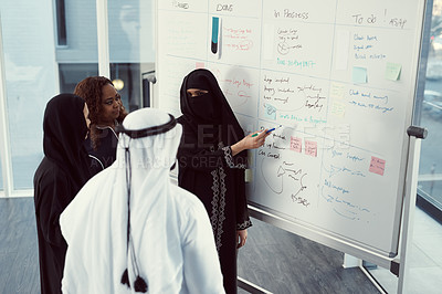 Buy stock photo Training, speaker and business muslim woman in office for investor workshop, team and teaching. Stakeholder update, coaching and presentation with employees in conference for meeting in Qatar
