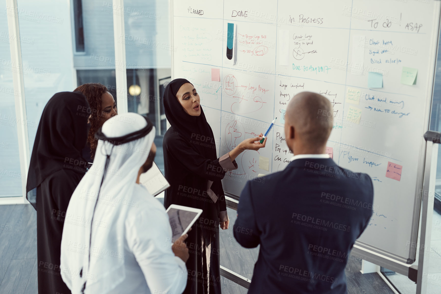 Buy stock photo Teaching, presentation and business muslim woman in office for investor workshop, team and training. Stakeholder update, coaching and speaker with employees in conference for meeting in Qatar
