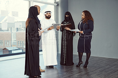 Buy stock photo Full length shot of a group of diverse business colleagues working together in their corporate office