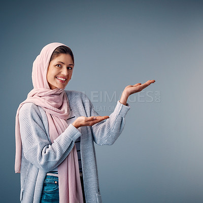 Buy stock photo Woman, hijab and palm with smile in portrait with mockup for advertising on blue background. Fashion, journalist and reporter for promotion with writer for arab with religion in faith with culture