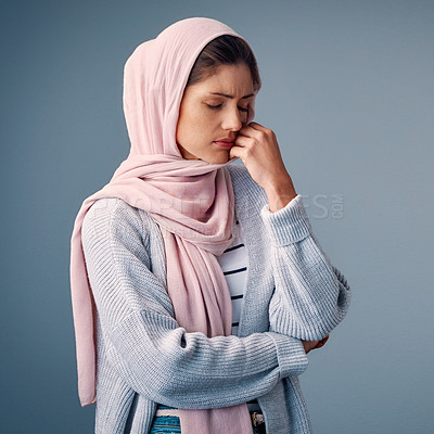 Buy stock photo Muslim woman, sad or stress of anxiety, depression or question of psychology, god or islamic studio. Girl, hijab or upset at thinking, burnout or fear of spiritual, faith or infertility on background