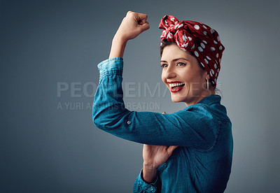 Buy stock photo Strong, flexing muscle and happy girl in studio for support, women power and pinup fashion. Female person thinking and laughing for bicep on grey background for motivation, freedom and vintage mockup