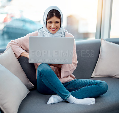 Buy stock photo Relax, sofa and Muslim woman with laptop for internet, social media and live streaming. Happiness, smile and Islamic girl sitting on couch with tech for connectivity at home, house and living room