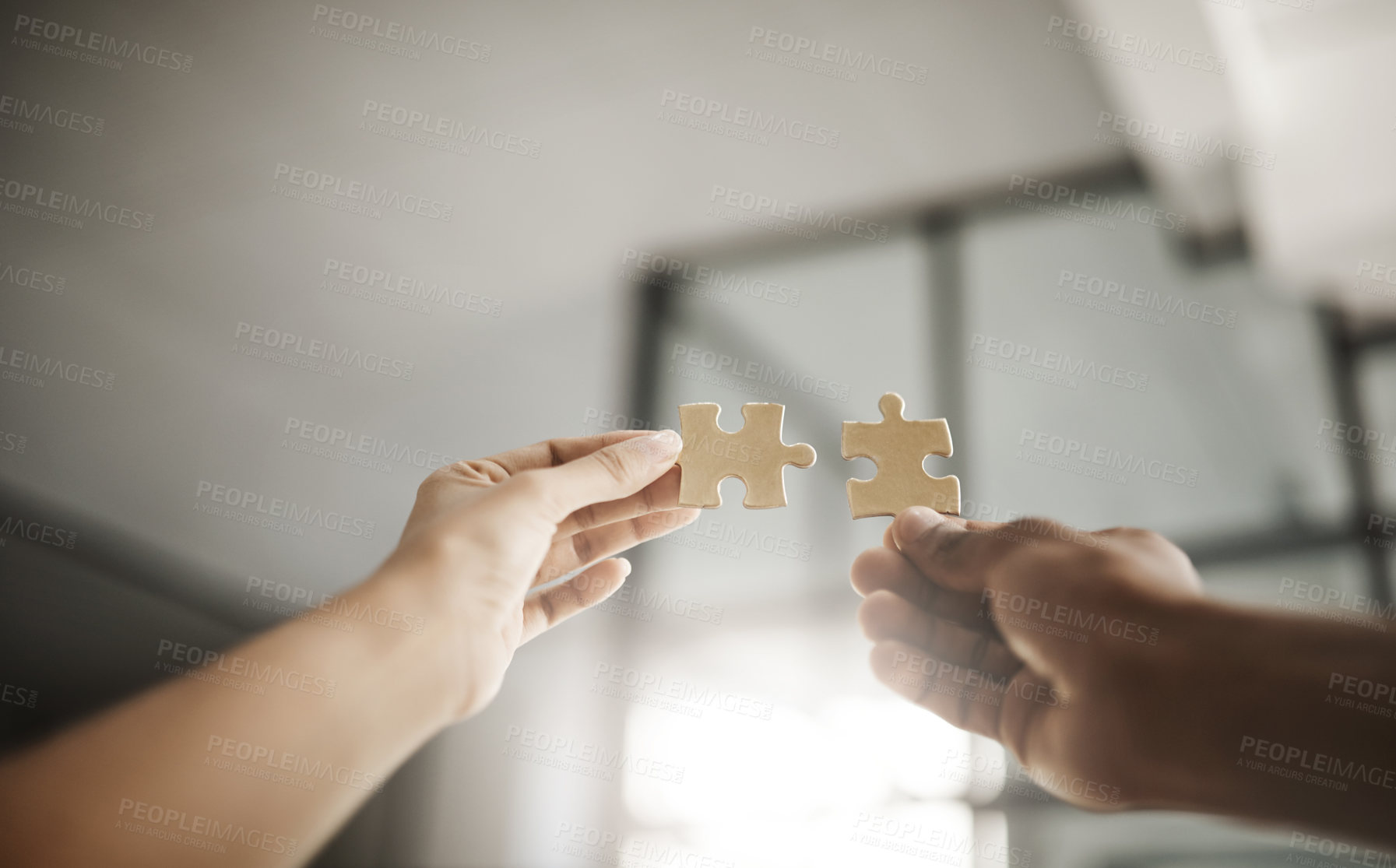 Buy stock photo Closeup hands of partners in unity, planning and working on strategy puzzle piece game. People collaborating on innovative jigsaw parts to fit together as part of teamwork planning project.