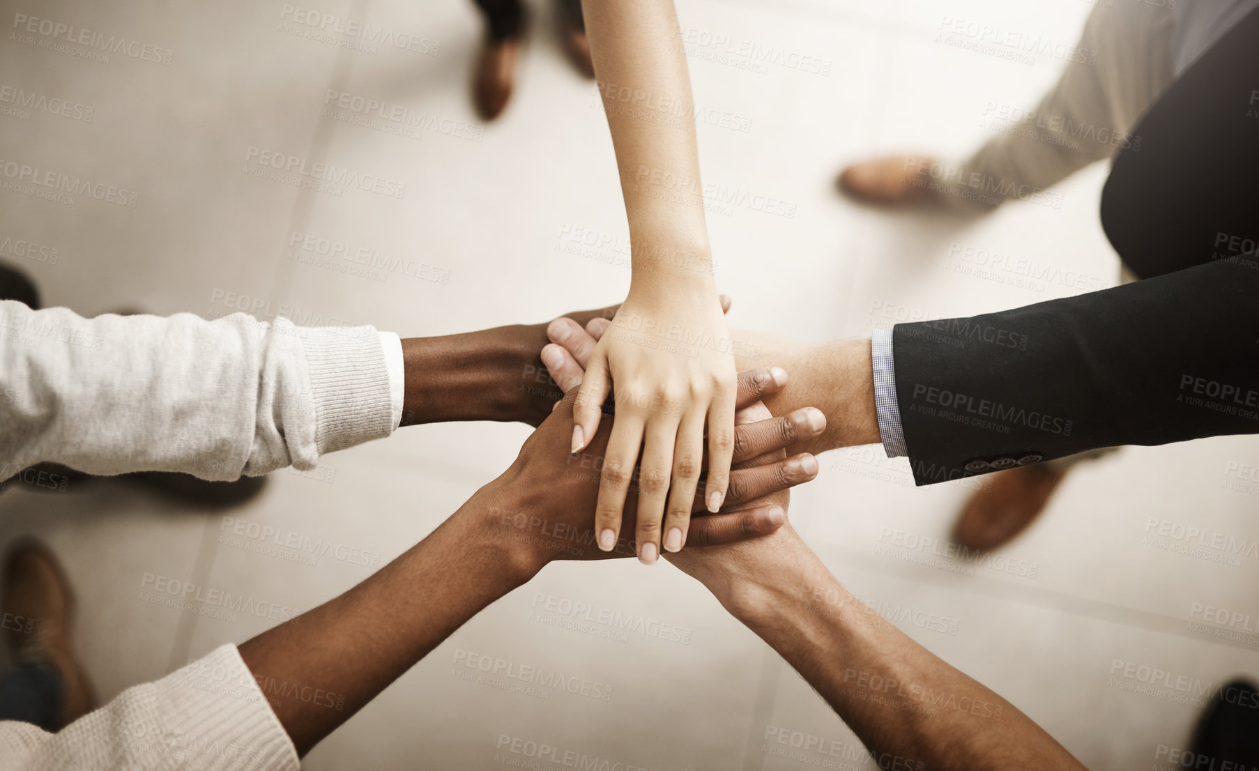 Buy stock photo Support, teamworking and joining hands together during team building session from above. Closeup of businesspeople doing stacked gesture to show collaboration in pursuit of goal or success in office

