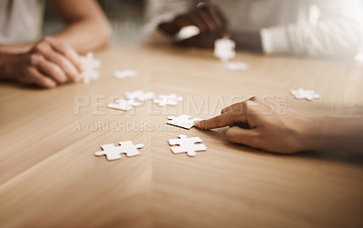 Buy stock photo Business people brainstorming solution, problem solving and showing teamwork, working together on puzzle pieces. Team or smart business group activity for unity workflow in difficult corporate crisis