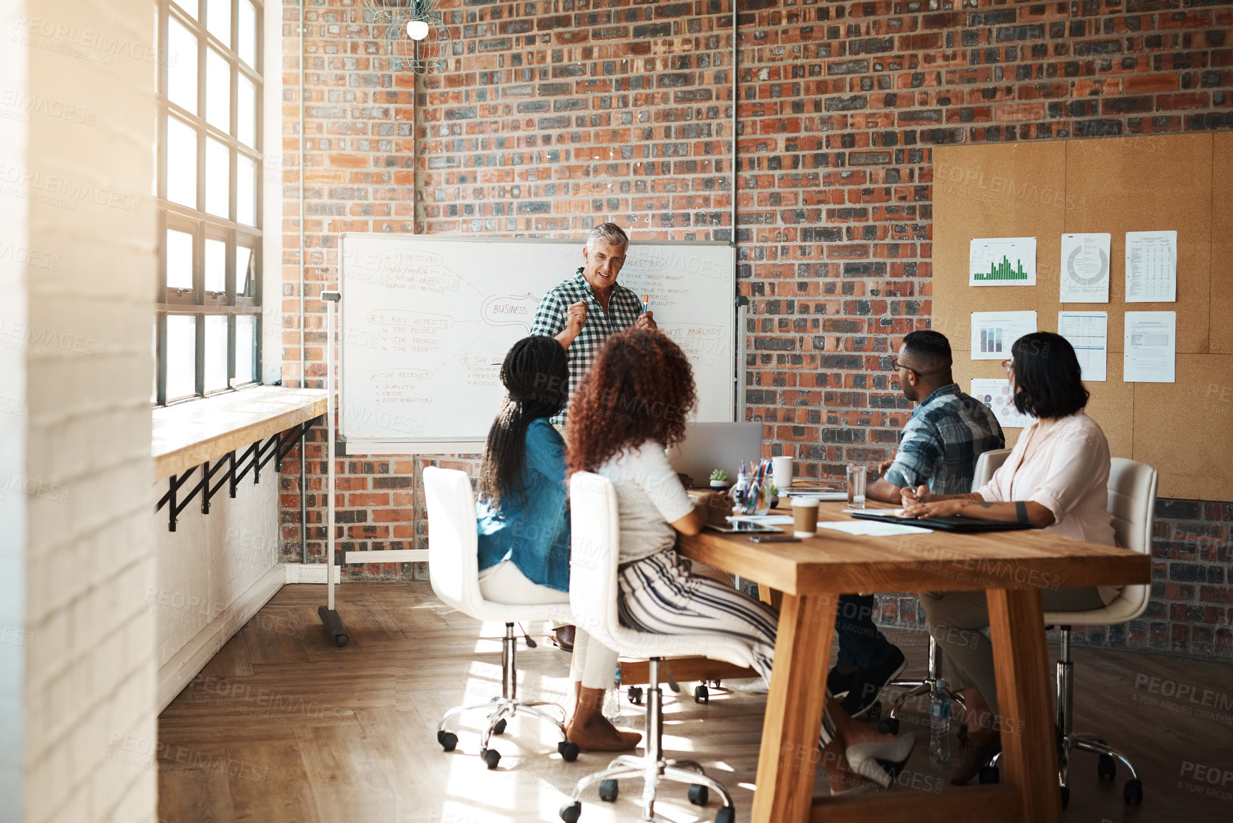 Buy stock photo Shot of a businessman giving a presentation in the boardroom