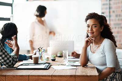 Buy stock photo Portrait of a young businesswoman sitting in a meeting in the boardroom