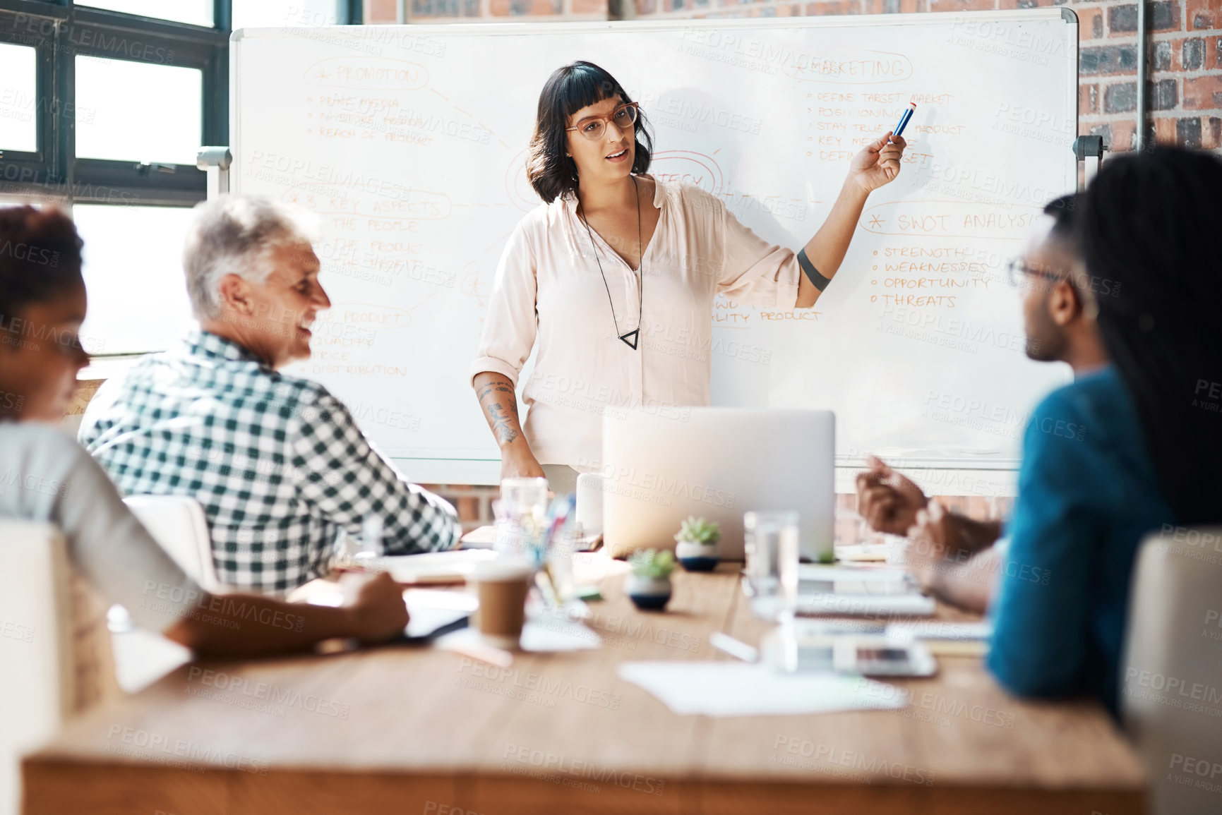 Buy stock photo Shot of a businesswoman giving a presentation in the boardroom