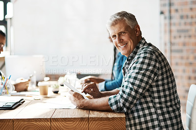 Buy stock photo Portrait of a mature businessman sitting in a meeting in the boardroom