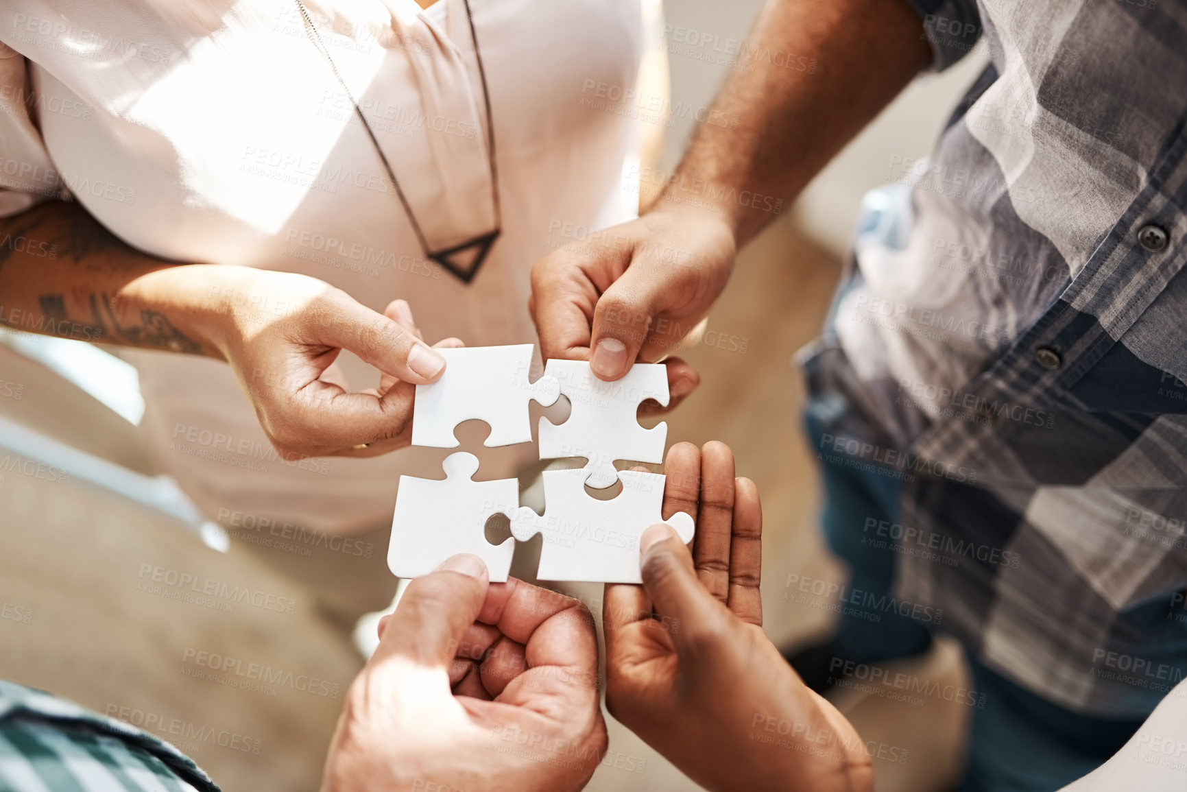 Buy stock photo Hands, group and jigsaw for strategy, solution and teamwork in collaboration for creativity at startup. People, integration and scrum for puzzle for problem solving, help and above for synergy at job