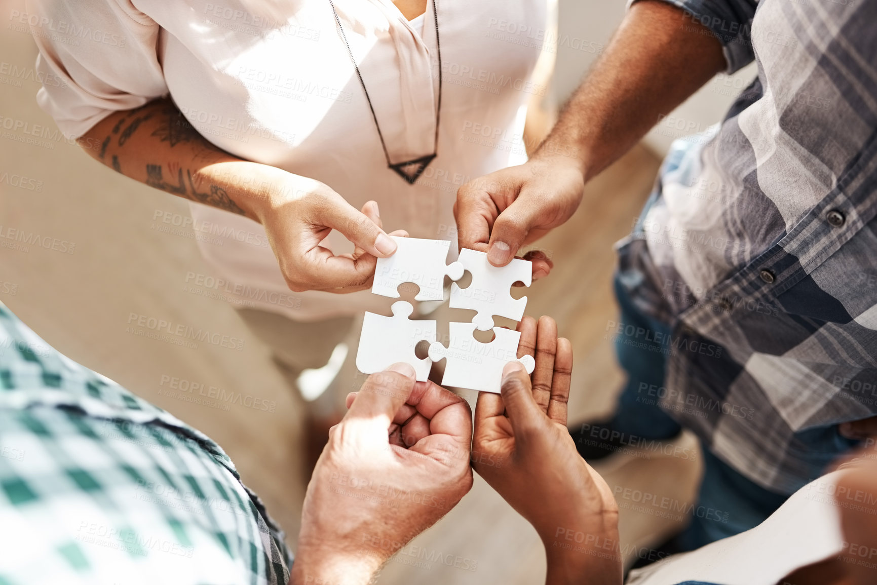 Buy stock photo Hands, team and jigsaw for strategy, solution and circle with collaboration for creativity at startup. People, group and scrum with puzzle for problem solving, solidarity or above for synergy at job