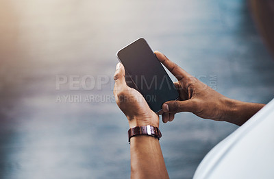 Buy stock photo Closeup shot of a businessman using a cellphone