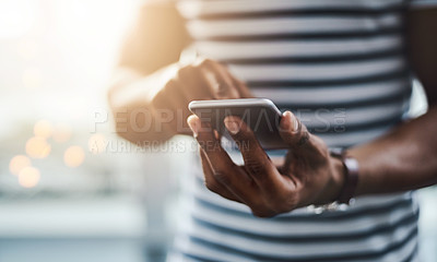 Buy stock photo Closeup shot of a businessman using a cellphone