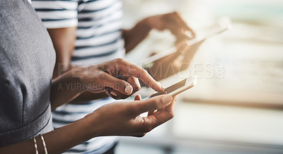 Buy stock photo Closeup shot of businesspeople using their digital devices in an office