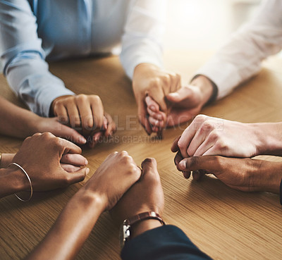 Buy stock photo Trust circle, therapy and people holding hands by a wood table at a group counseling or psychology session. Gratitude, spiritual and friends praying together for religion, community and connection.