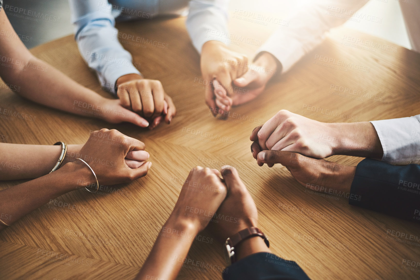 Buy stock photo Praying, holding hands and group with religion, table and belief in God, Christian and faith in holy spirit. Support, solidarity or together to worship, praise and trust in Christ or people in church