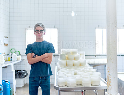 Buy stock photo Cropped shot of a man working in a cheese factory