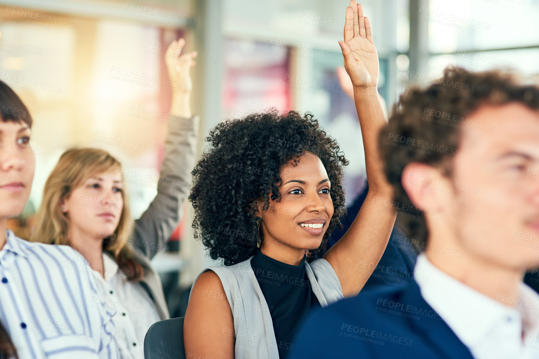 Buy stock photo Cropped shot of an attractive young businesswoman sitting with her hands raised in a conference room during a seminar