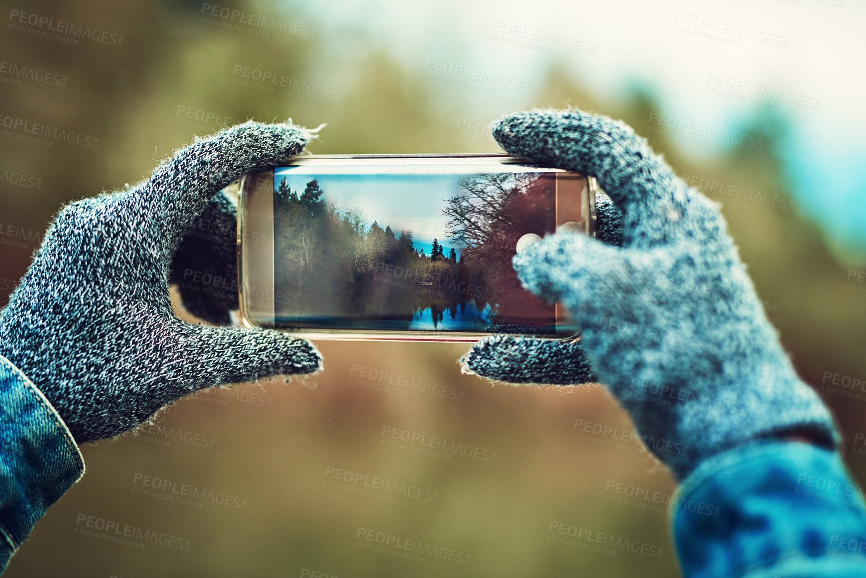 Buy stock photo Cropped shot of an unrecognizable woman taking a picture outdoors