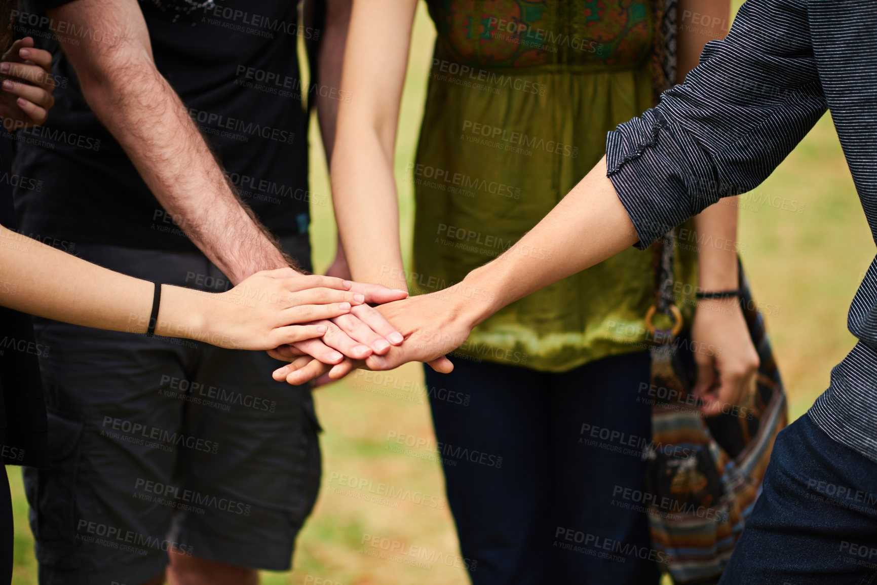 Buy stock photo Cropped shot of unrecognizable college students hands piled on top of each other outside