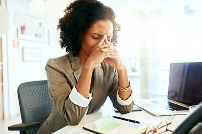 Buy stock photo Cropped shot of a businesswoman suffering from a headache