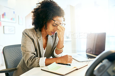 Buy stock photo Cropped shot of a businesswoman suffering from a headache