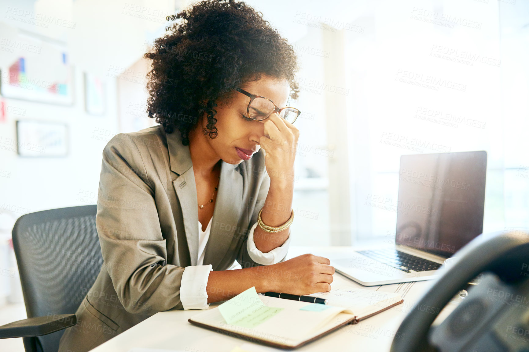 Buy stock photo Cropped shot of a businesswoman suffering from a headache