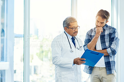 Buy stock photo Mature doctor, man patient and results with medical consultation and discussion in clinic. Hospital, diagnose and health insurance checklist of a healthcare and wellness professional talking 