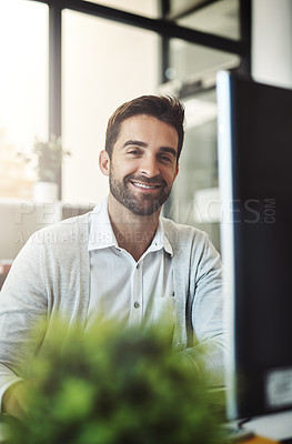Buy stock photo Cropped shot of a handsome businessman working on his computer