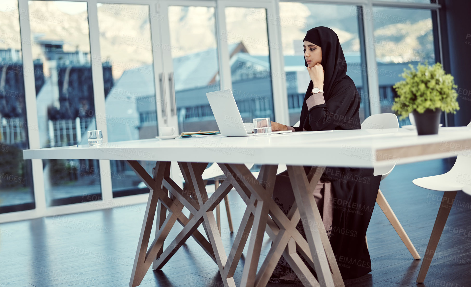 Buy stock photo Muslim, woman and thinking with laptop at agency for news story angle, article inspiration or editing. Islamic, journalist and thoughtful with tech in office for planning newsletter and source review