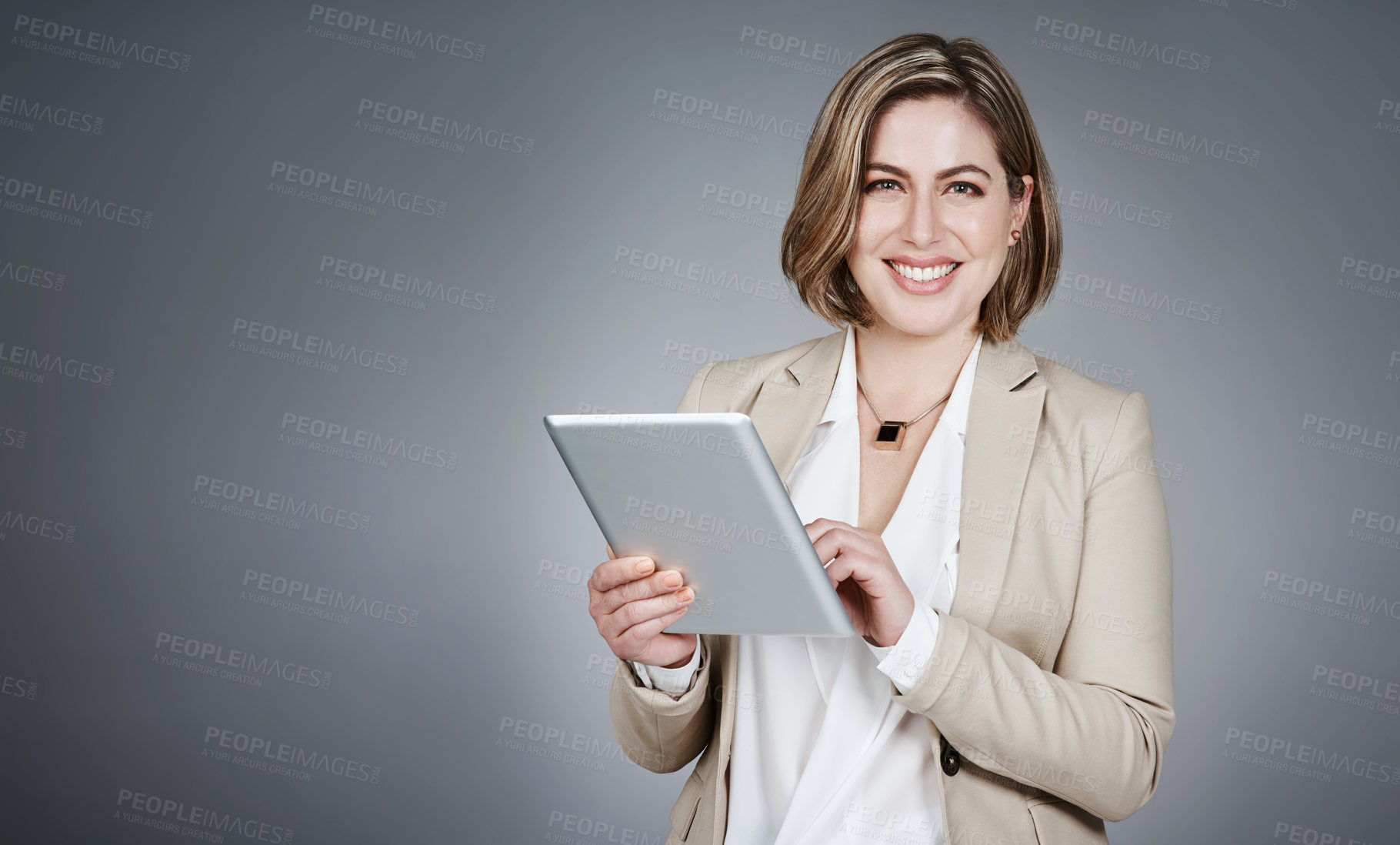 Buy stock photo Portrait, business and woman with tablet in studio for real estate, property research and listing. Mockup space, realtor and digital for auction agenda, viewing proposal and resale on gray background