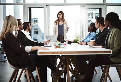 Buy stock photo Shot of a businesswoman giving a presentation to her colleagues in a boardroom