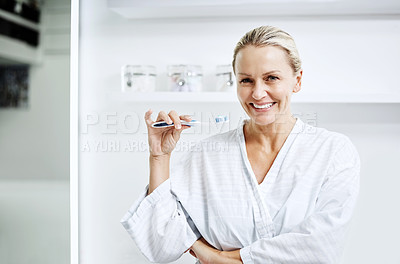 Buy stock photo Cropped shot of a mature woman posing with a toothbrush