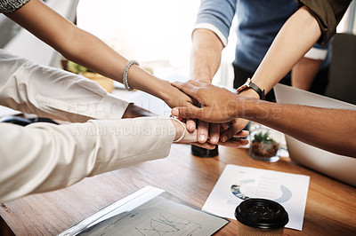 Buy stock photo Shot of an unrecognisable group of businesspeople joining their hands together in unity
