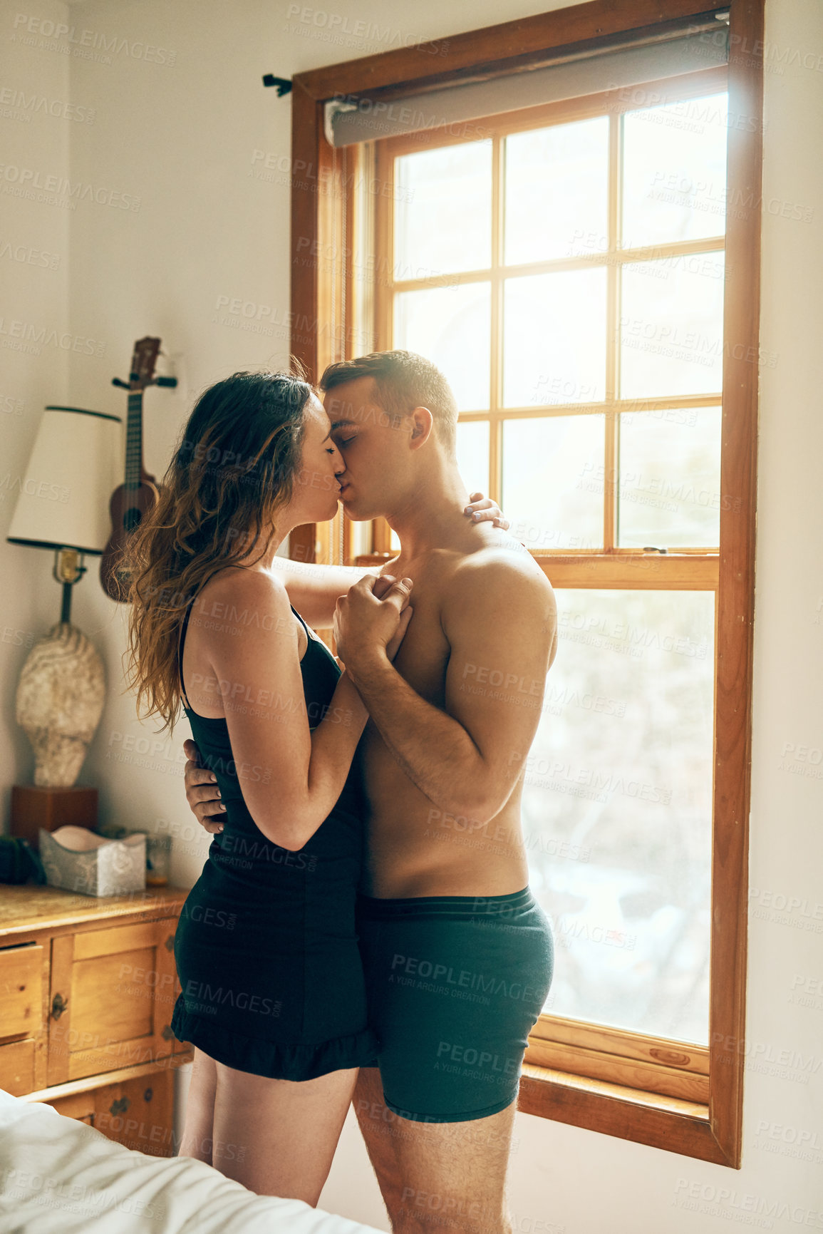 Buy stock photo Kiss, romance or couple hug  in bedroom for affection with love, bonding or relationship for pleasure. Foreplay intimacy, morning or people in home on valentines day, anniversary or sensual passion