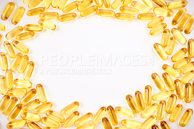 Buy stock photo Studio shot of a lot of medical pills scattered against a white background