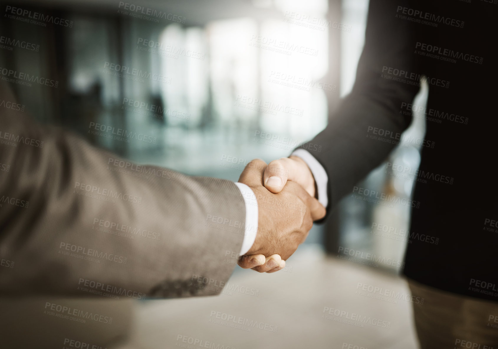 Buy stock photo A professional handshake after an interview meeting for a company in a modern corporate office. Formal executive businessmen shaking hands after a successful collaboration leading to a job promotion