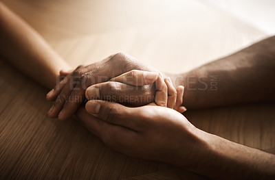 Buy stock photo People, desk and holding hands in therapy for support, care and comfort with professional help. Trust, empathy and consultation on healthcare with wellbeing, wellness and love for kindness and unity