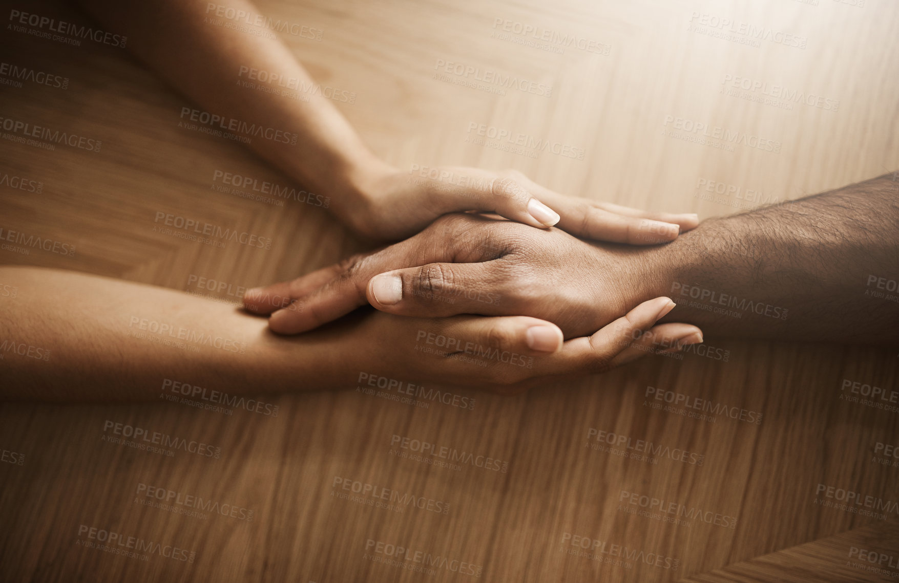 Buy stock photo Love, support and care with people holding hands at a table, talking, bonding and showing affection. Couple having a discussion about relationship. Woman helping husband with his mental health