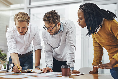 Buy stock photo Cropped shot of a group of businesspeople having a brainstorming session