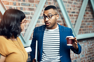 Buy stock photo Shot of two designers having a discussion in an office
