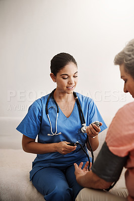 Buy stock photo Woman, blood pressure and doctor in hospital for service healthcare, heart rate or hypertension appointment for wellness. Medic, diabetes patient and medical exam to check pulse, results or advice
