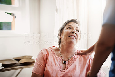 Buy stock photo Cropped shot of an unrecognizable caregiver assisting a senior patient in a nursing home